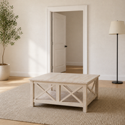 In scale | unfinished square rubberwood coffee table beside a full-height interior doorway