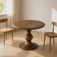 Angle | same dining room, table at a three-quarter so the top, urn pedestal, and stepped foot all read
