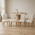 In a room | all four matching chairs at a flax dining room's oval table, bright midday light from the left