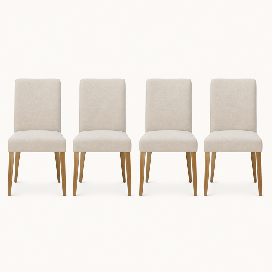 Front | all four matching chairs centered on paper, beige linen weave and the tapered wood legs visible
