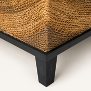 Detail | close view of the brown wicker weave and black wood base