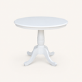 Front | white round table centered on paper, scalloped rim and four curved feet facing the camera