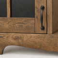 Wood-grain detail | close view of brown wood grain and the curved apron beside a black iron pull