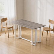 Angle | same dining room, table at a three-quarter so the gate-leg trestle and leaf seams both read
