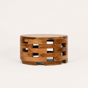 Side | low side profile of the round wood coffee table showing its open slat bands