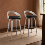 In a warm dining corner | both stools on a plain rug against terracotta walls