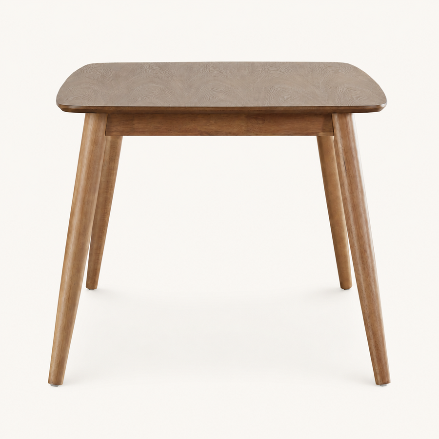 Front | Natural rectangular table centered on paper, four tapered legs and apron facing camera