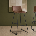 Kolvern Pietralunga Sled Base Leather Bar Stool in a restyled supplier room | Pipeline B room-shell edit 2