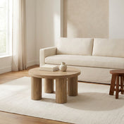 Kolvern Oak Pillar Coffee Table three quarter view in a Tloom living room