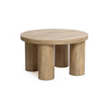 Studio | Three-quarter studio view showing the thick round top edge and the four pillar legs