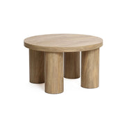 Studio | Three-quarter studio view showing the thick round top edge and the four pillar legs