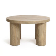Front | Round table straight on against a plain ground, all four cylindrical legs visible