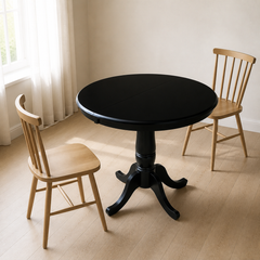 Angle | same room, table at a three-quarter so the turned pedestal and curved legs both read