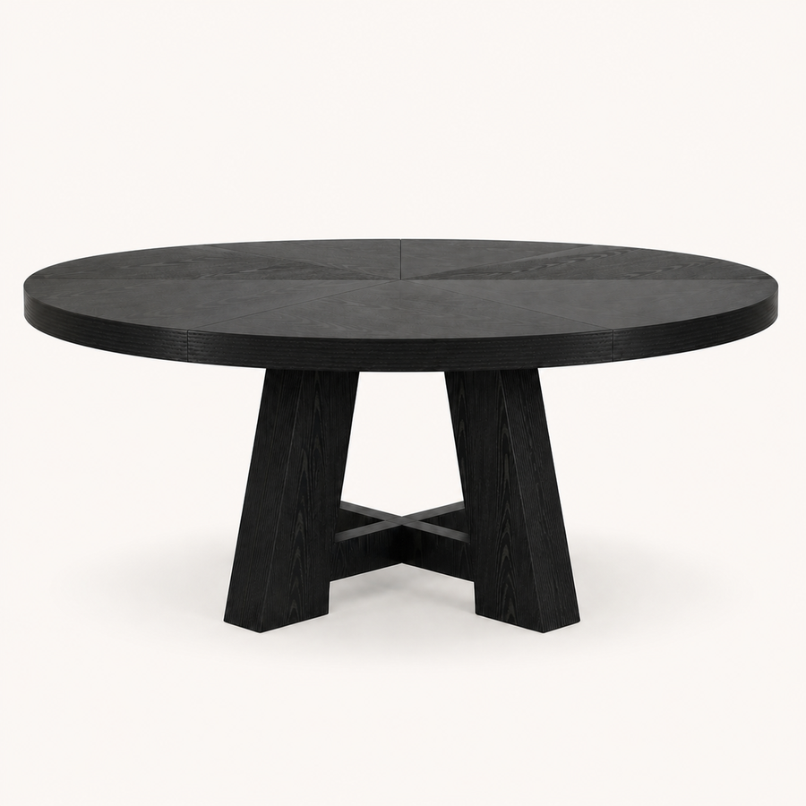 Front | round black trestle dining table centered on paper studio background, front elevation