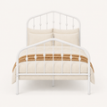 Front | Straight-on studio view of the complete white metal bed with arched headboard and footboard