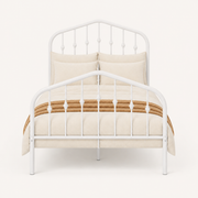 Front | Straight-on studio view of the complete white metal bed with arched headboard and footboard