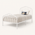 Studio | Angled studio view showing the open metal rails, spindle details, and corner legs