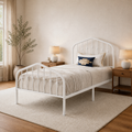 Angle | Three-quarter view of the white arched spindle bed with bedding and a textured rug