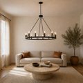 Living room | the chandelier centered above a round travertine coffee table