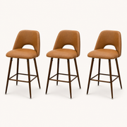 Studio | all three stools at a true three-quarter studio angle, keyhole back and footrest ring both reading