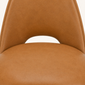 Closer | caramel-brown faux leather grain and the seam where the back meets the seat