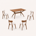 Studio | three-quarter view of the trestle base and all four upholstered chair backs