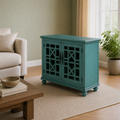 Sage angle | teal-green cabinet from a right-front angle with solid side panel, sofa, table and window