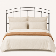 Front | Straight-on studio view of the full arched headboard on a pale backdrop