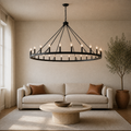 Living room | the wagon-wheel chandelier over a coffee table