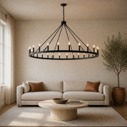 Living room | the wagon-wheel chandelier over a coffee table