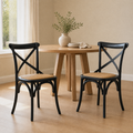 In a room | the pair beside a round table in a warm flax dining room, bright soft midday light