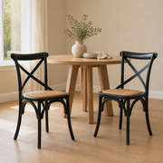 In a room | the pair beside a round table in a warm flax dining room, bright soft midday light