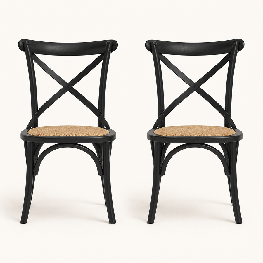 Front | both black cross-back rattan side chairs centered on paper, matte black frame and natural rattan seats visible
