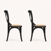 Side | profile view of both chairs showing the tapered leg splay and the wishbone stretcher