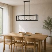 Room 1 | Matte black five-light linear chandelier above a pale oak dining table