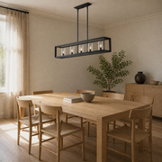 Room 1 angle | Angled dining-room view of the matte black five-light linear chandelier
