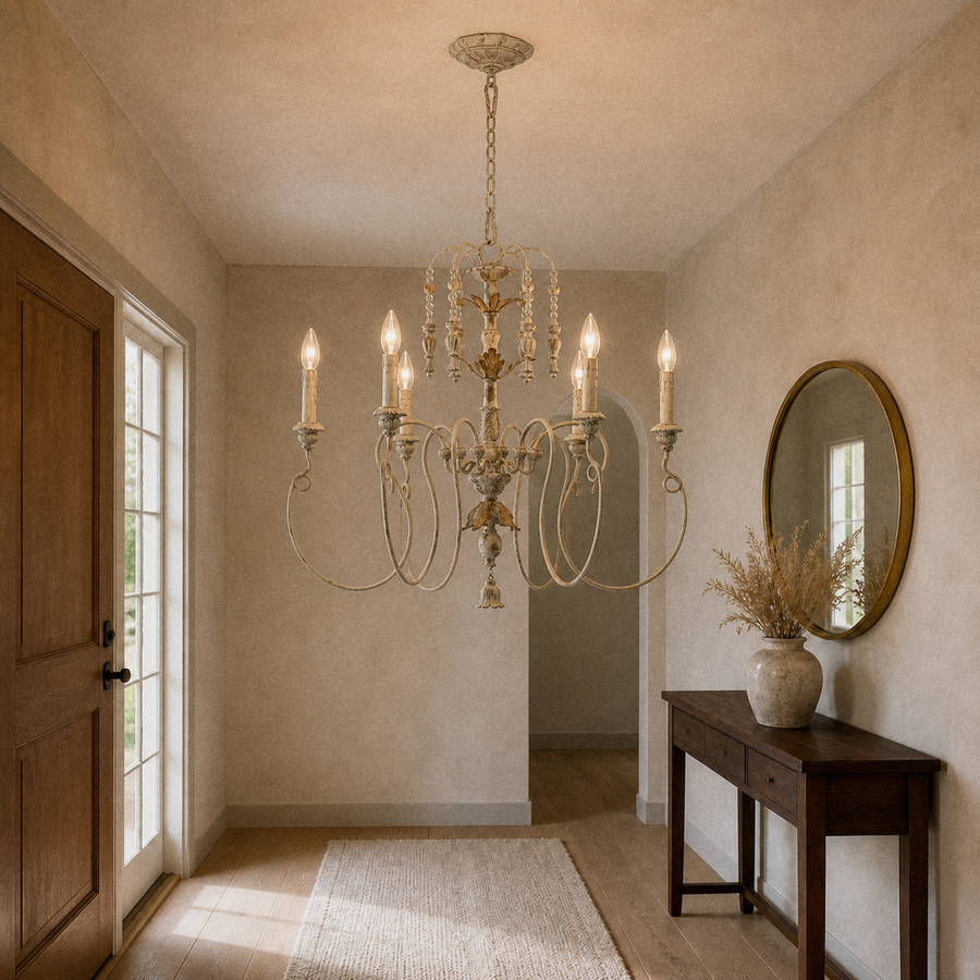 Entry | the same chandelier hung in a foyer beside a console table and mirror