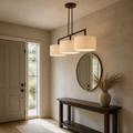 Entry | the same pendant hung lengthwise above an entryway console table