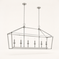 Side | polished chrome 6-light linear chandelier from a low side studio angle showing cage depth, dual chains, and six candle bulbs