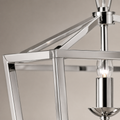 Texture | close view of polished chrome cage corner, diagonal brace, and candle sleeve