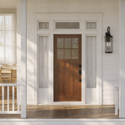 In scale | Antique bronze wall lantern beside a full-height entry door