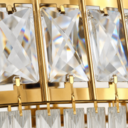 Hardware | close view of the gold clips holding the crystal