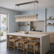 In a room | marnau Baluden 8-Light Crystal Pendant in a pale-blue kitchen