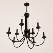 Profile | worm's-eye studio view of the dark bronze nine-light chandelier, chain, canopy, and curved arms