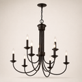 Angle | dark bronze nine-light chandelier from an elevated corner view showing the two tiers and curved arms