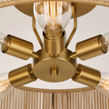 Close detail | brass hub, sockets, arms, and clear bulb glass
