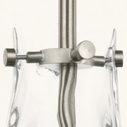Detail | the brushed nickel set-screw fitting where the rod clamps the glass