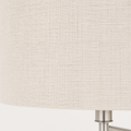 Close view | fine cross-hatch weave on the off-white linen-blend drum shade with a brushed nickel arm edge