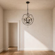Scale view | English Bronze globe chandelier beside a full-height doorway