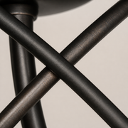 Close view | matte English Bronze intersecting metal rings with visible fine surface texture